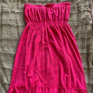 Hot pink strapless cover up.